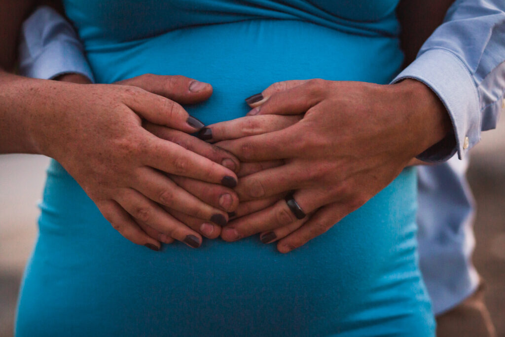 maternity, belly, blue dress, holding hands, love